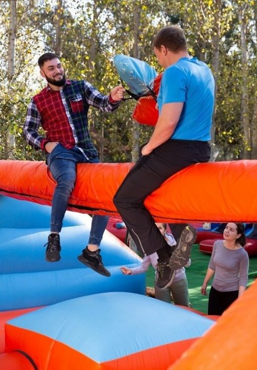 Men having funny battle at amusement park