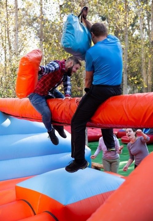 Men having funny battle at amusement park